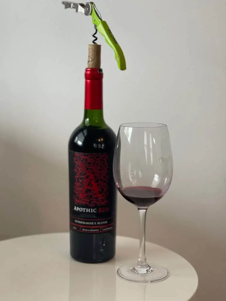 bottle of apothic red blend with wine glass