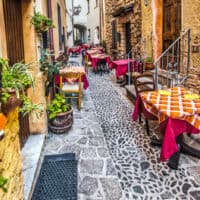 sARDINIA ITALY STREET WITH WINE BOTTLES. bLUE ZONE