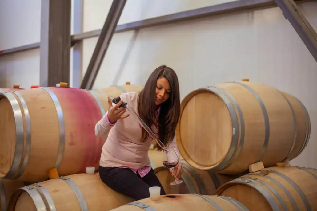 female winemaker creating a red blend