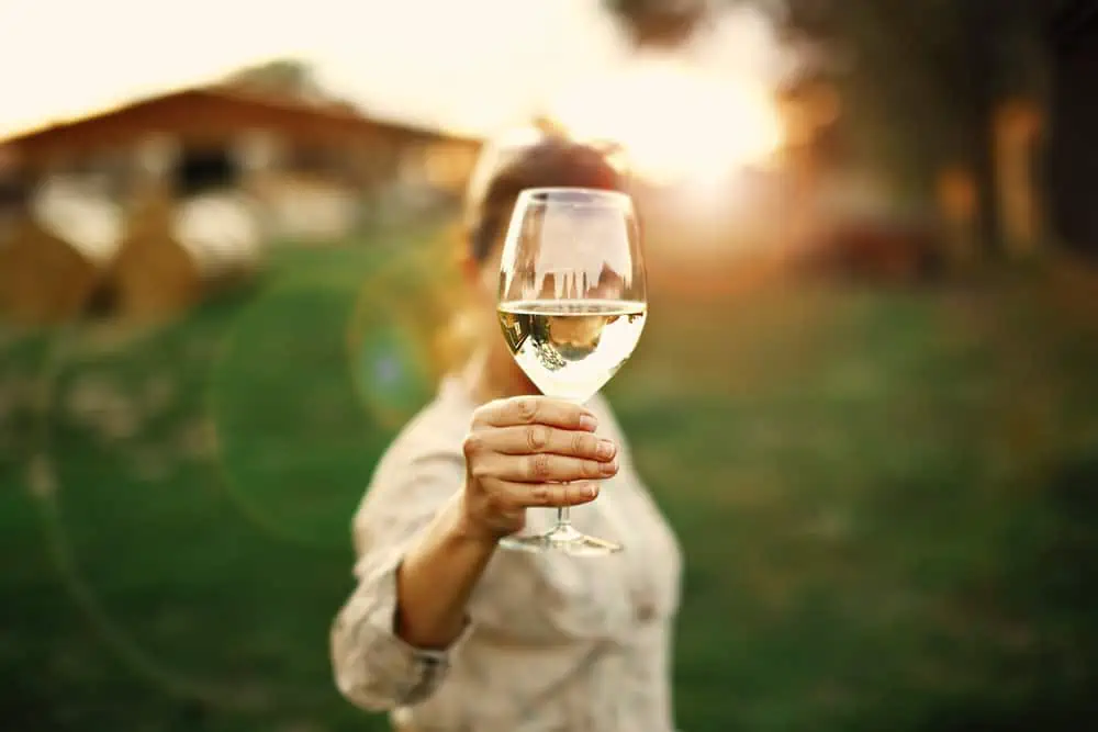 woman with glass of wine from a wine club
