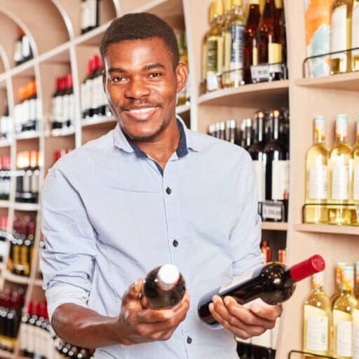 African,Man,As,A,Customer,With,Two,Bottles,Of,Wine